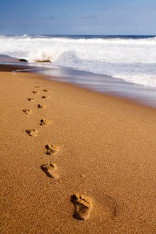 Discover Reflexology/Prices. Library Image: Footsteps in Sand